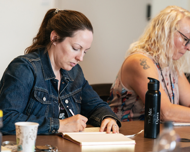 Image of someone writing in their notebook Image of someone writing in their notebook