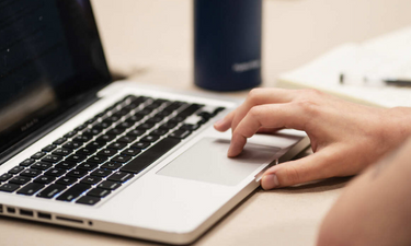 person typing on computer